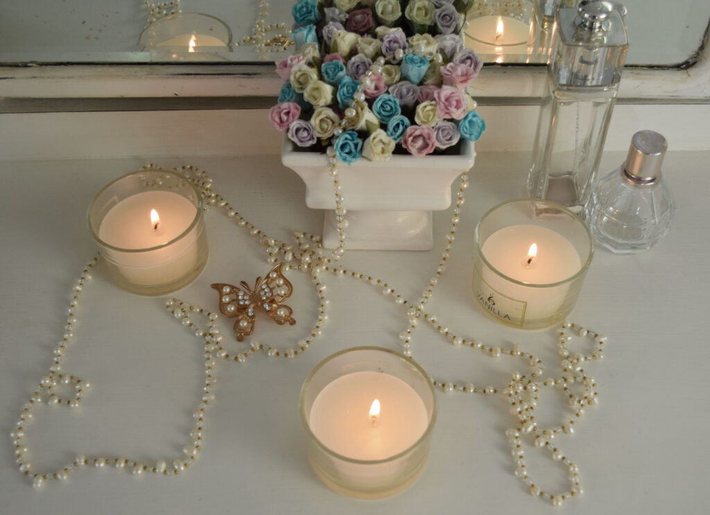 lite candles and floral arrangement